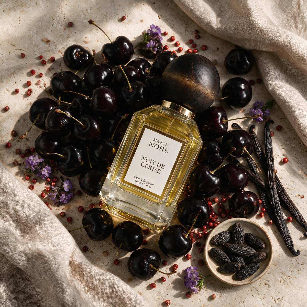 Nuit de Cerise, Maison Nohe, entouré de ses notes : cerise noire, baies roses, vanille, fève tonka, héliotrope